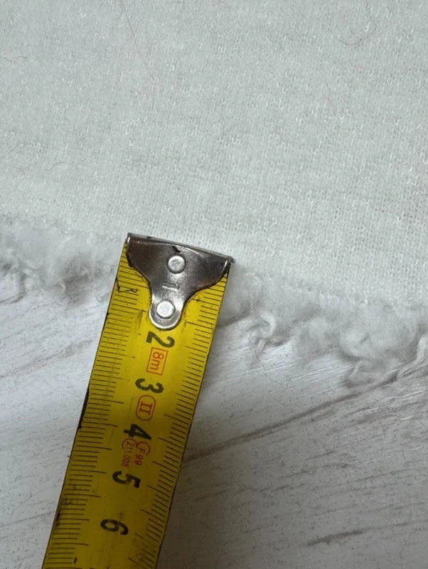 Coupon tissu fausse fourrure douce et légère à poils mi-longs frisés blanc 30cm x 155cm