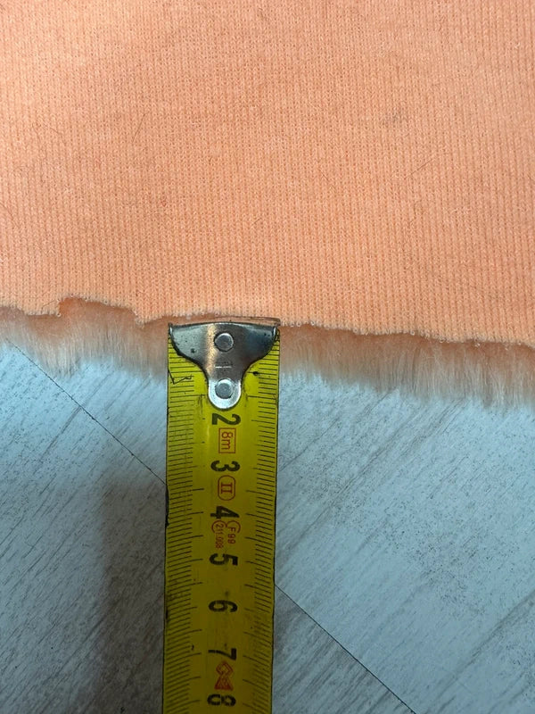 Coupon tissu fausse fourrure à poils mi-longs corail 30cmx80cm