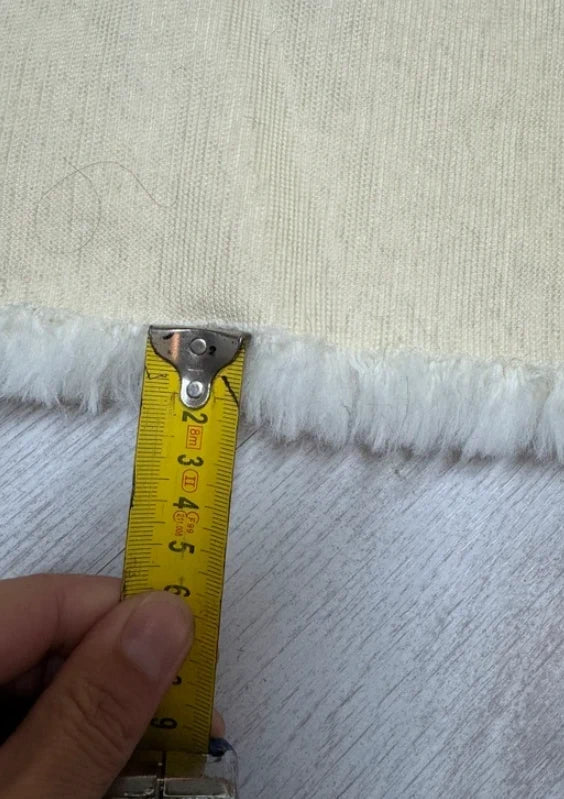 Soft and thick faux fur fabric coupon with cream white curly medium-length hair 39cm x 160cm