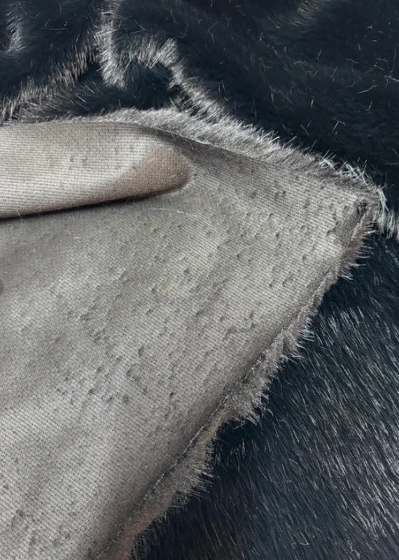 Coupon tissu fausse fourrure douce de qualité noir à poils mi-longs 35cmx90cm