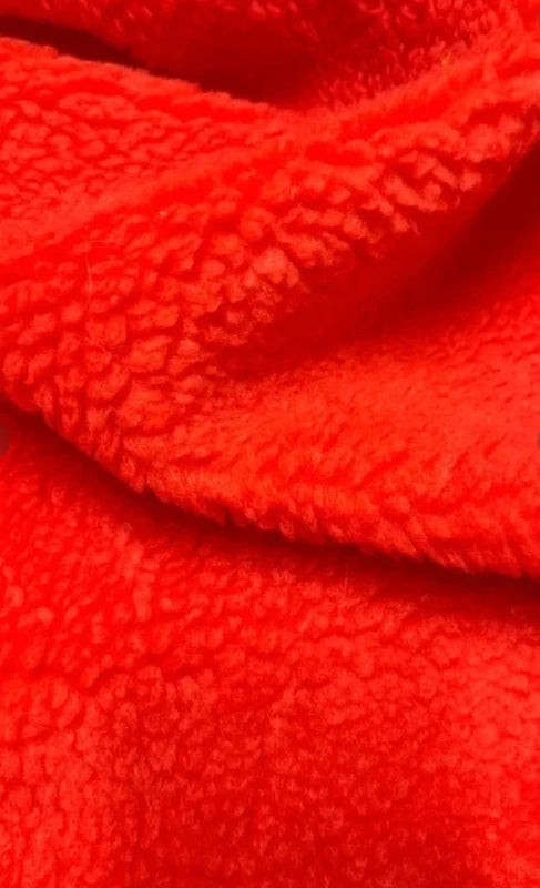 Coupon tissu fausse fourrure douce moutonnée à poils mi-longs orange 30cm x 160cm