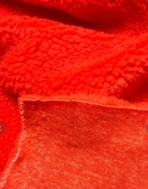 Coupon tissu fausse fourrure douce moutonnée à poils mi-longs orange 30cm x 160cm