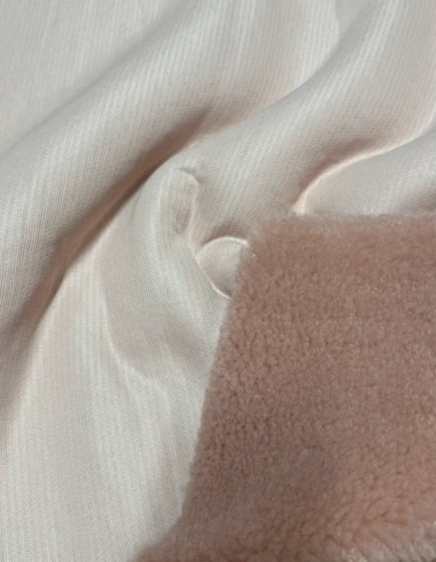 Coupon tissu fausse fourrure douce moutonnée à poils mi-longs rose 30cm x 89cm