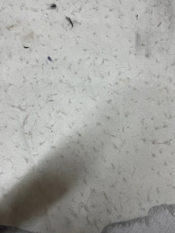 Coupon tissu fausse fourrure douce à poils mi-longs frisés blanc 30cm x 70cm