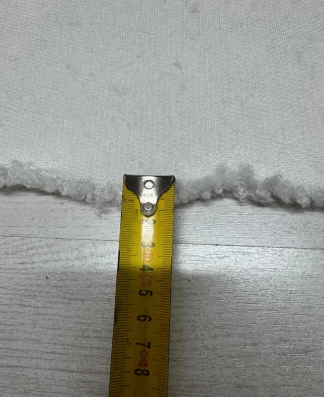 Coupon tissu fausse fourrure douce et légère à poils mi-longs frisés blanc 30cm x 150cm