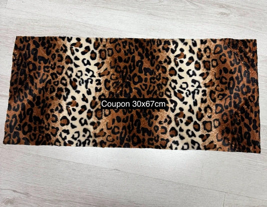 Lightweight, short-pile faux fur fabric remnant in brown, black, and beige print