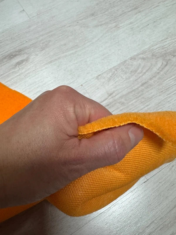 Coupon fausse fourrure touché polaire à poils courts orange 23cmx82cm