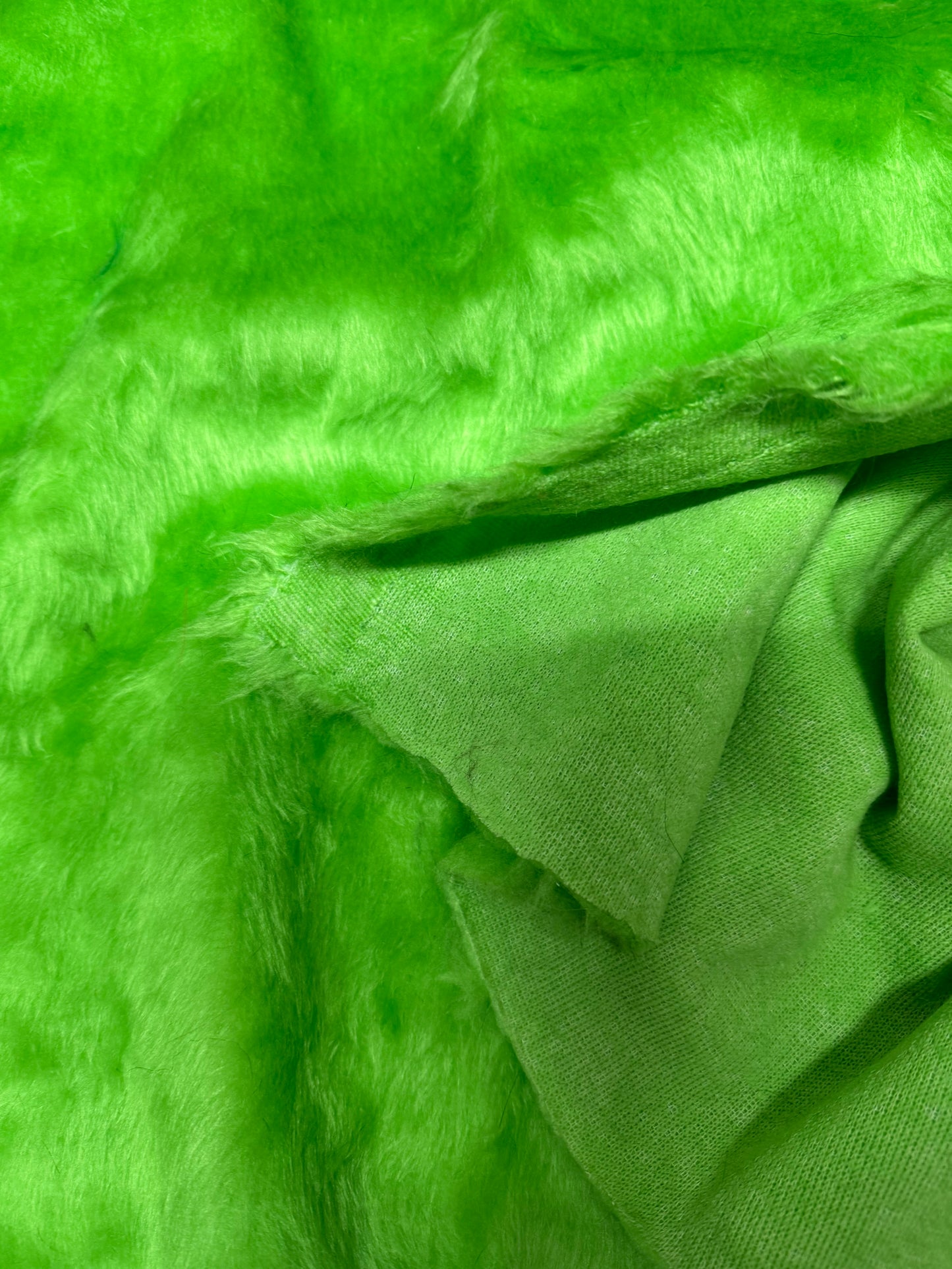 Apple green lightweight faux fur fabric remnant with medium-length pile 20cmx150cm