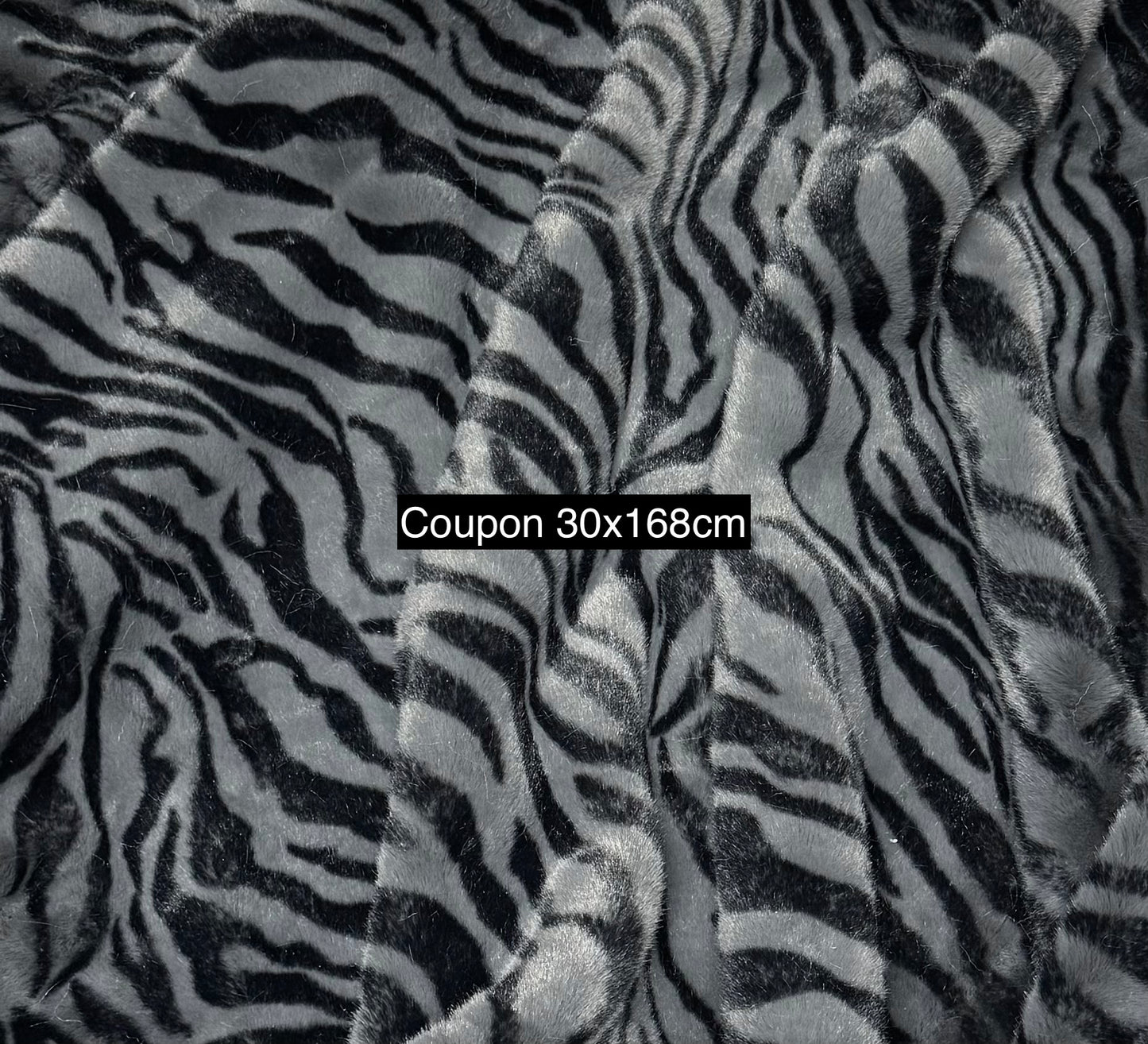 Coupon tissu fausse fourrure zébrée gris noir 30x168 cm – poils 1,5 cm