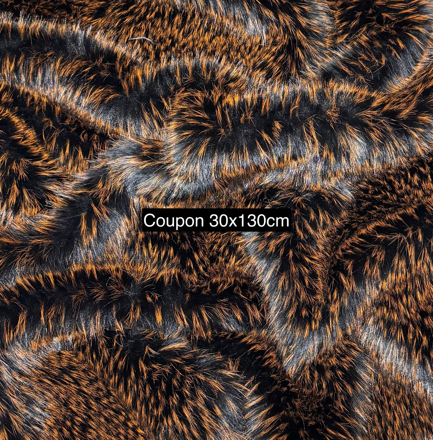 Coupon fausse fourrure noir à mèches orange 30x130 cm – poils ~3,5 cm