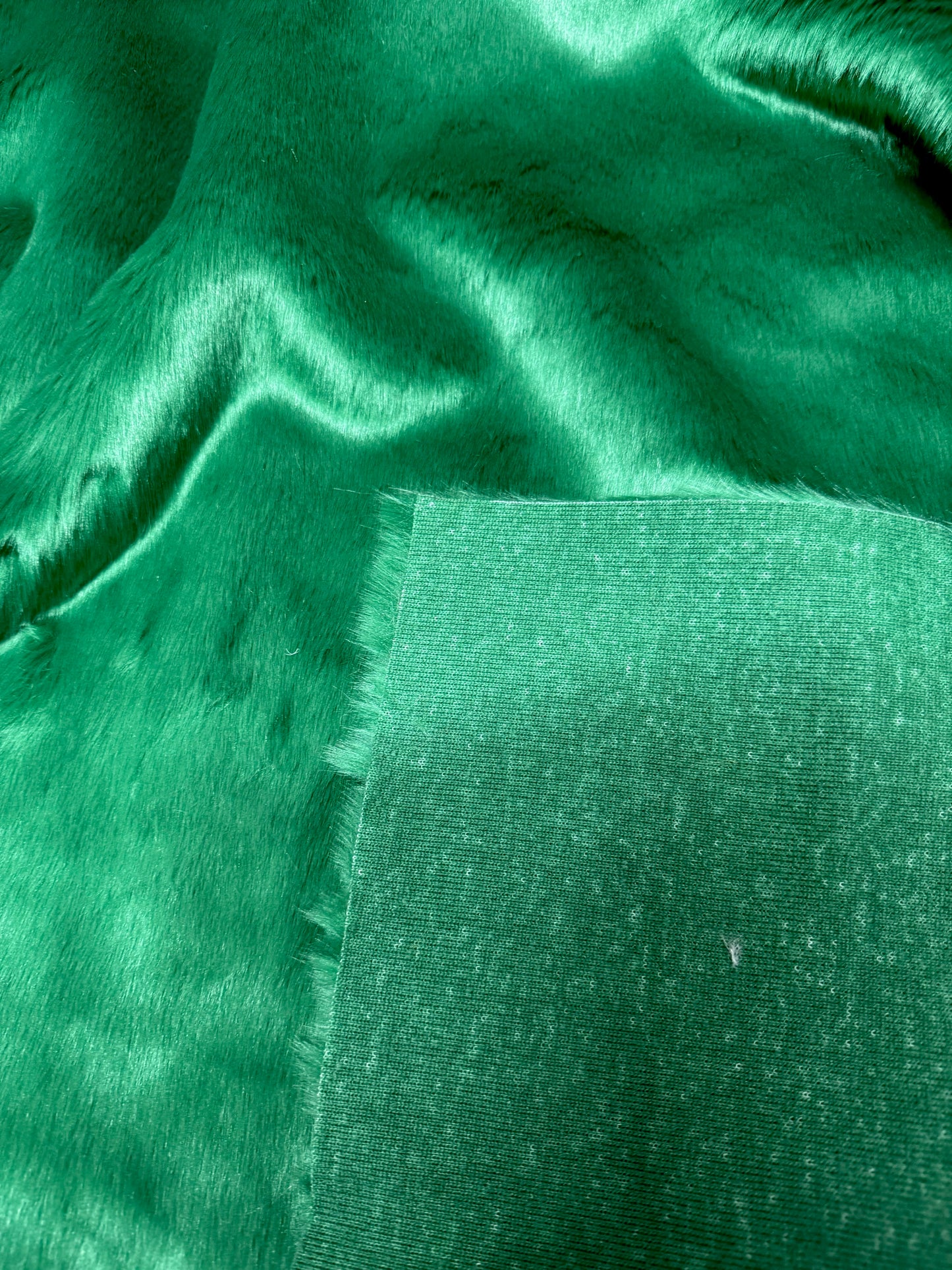 Coupon fausse fourrure vert émeraude poils 2 cm – 30x158 cm