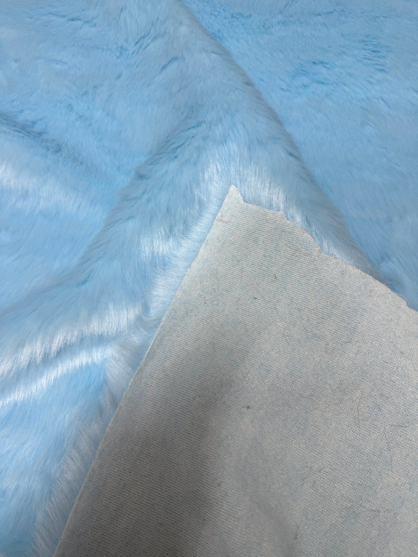 Coupon fausse fourrure bleu clair 21x73cm poils 2cm doux