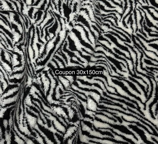fausse fourrure zébrée noire et blanche bouclée texture gros plan