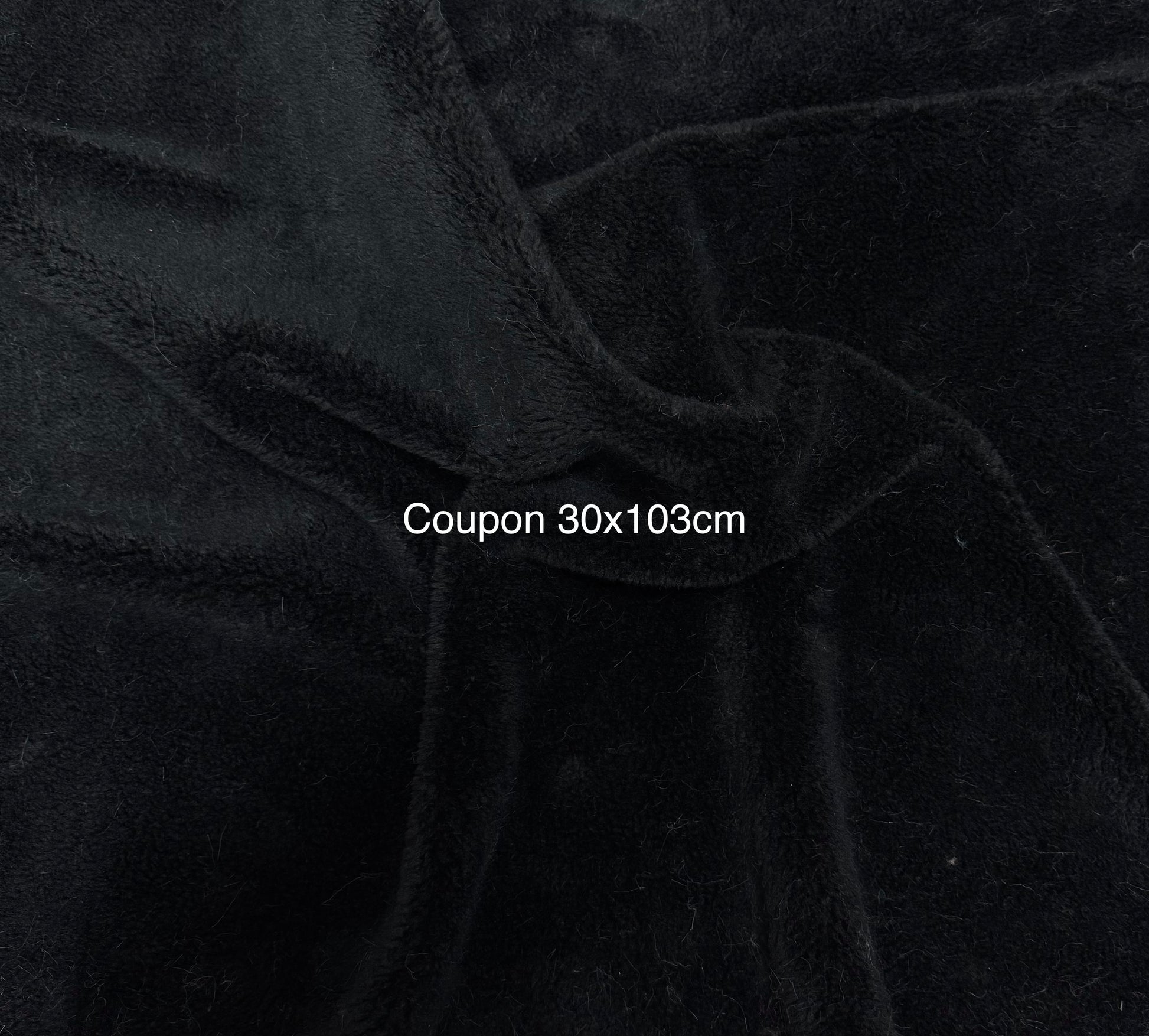 Coupon tissu fausse fourrure noire bouclée effet mouton 30x103 cm