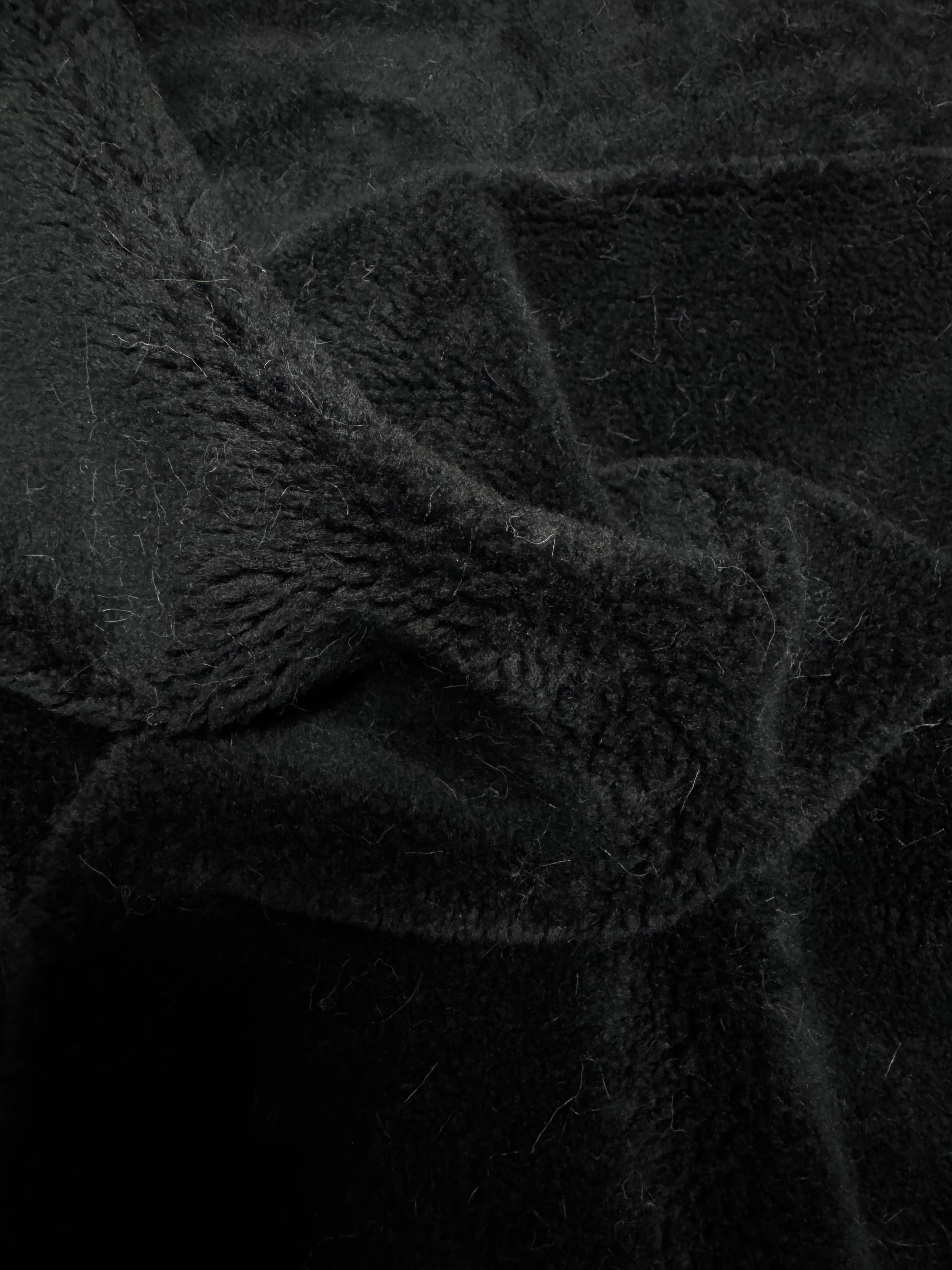 Fausse fourrure noire texture mouton pour couture ours de collection
